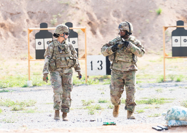Two U.S. soldiers at outdoor shooting range