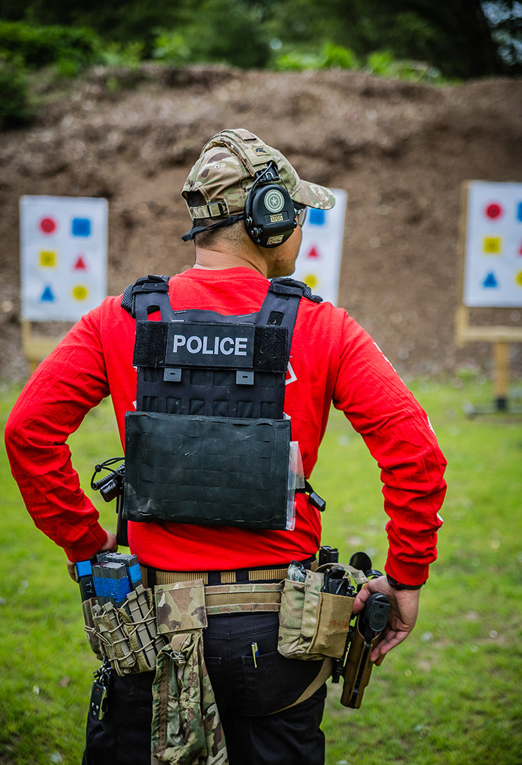 A person standing at a shooting range.